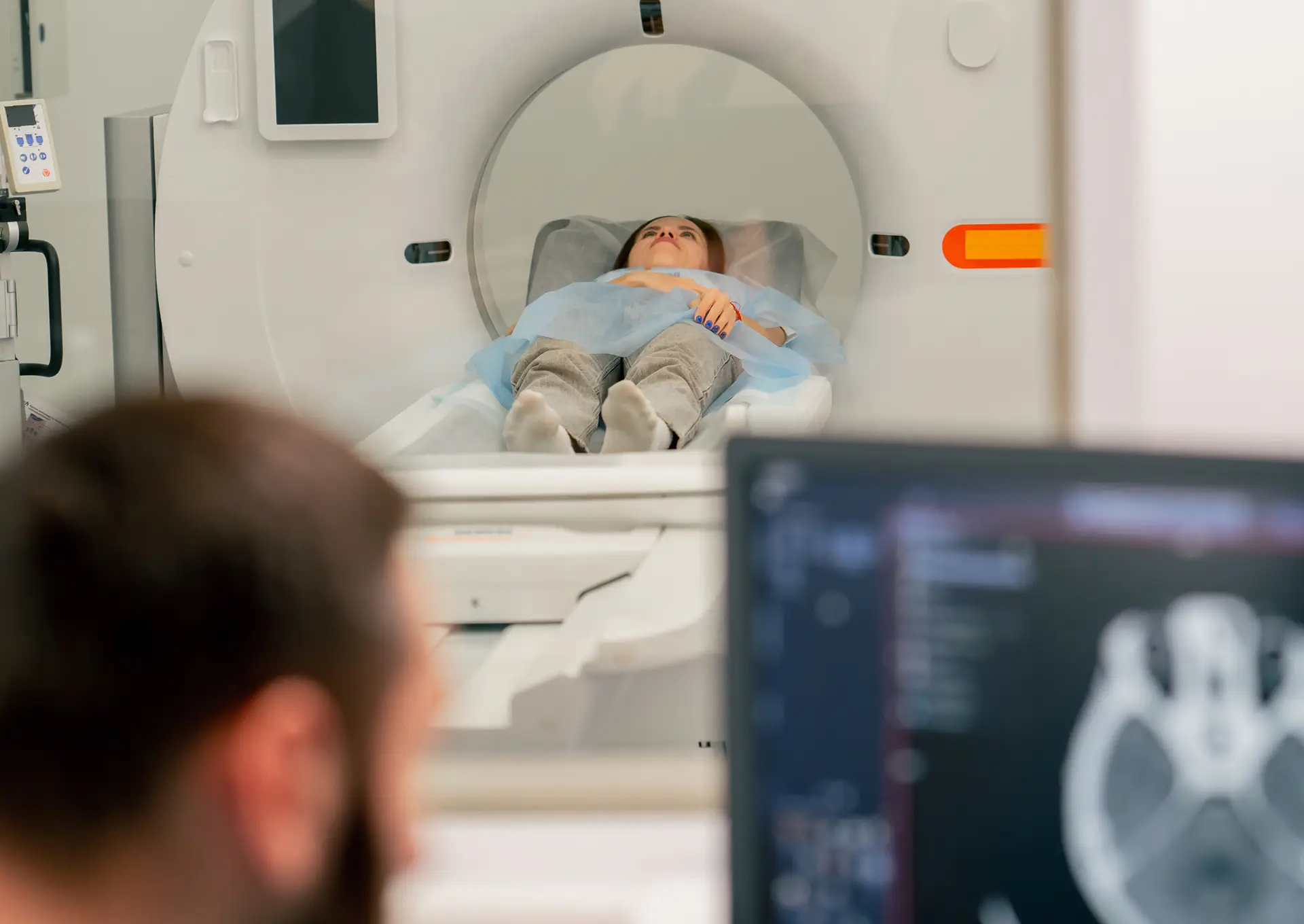 Radiologist reviewing medical imaging scans